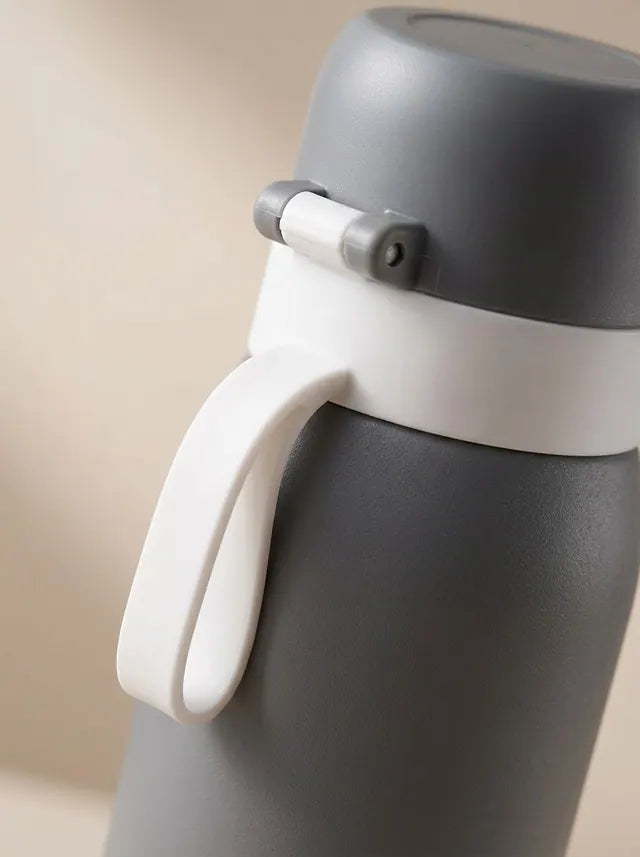 Detail van de dop, draaglus en RVS behuizing van Letsfil V1